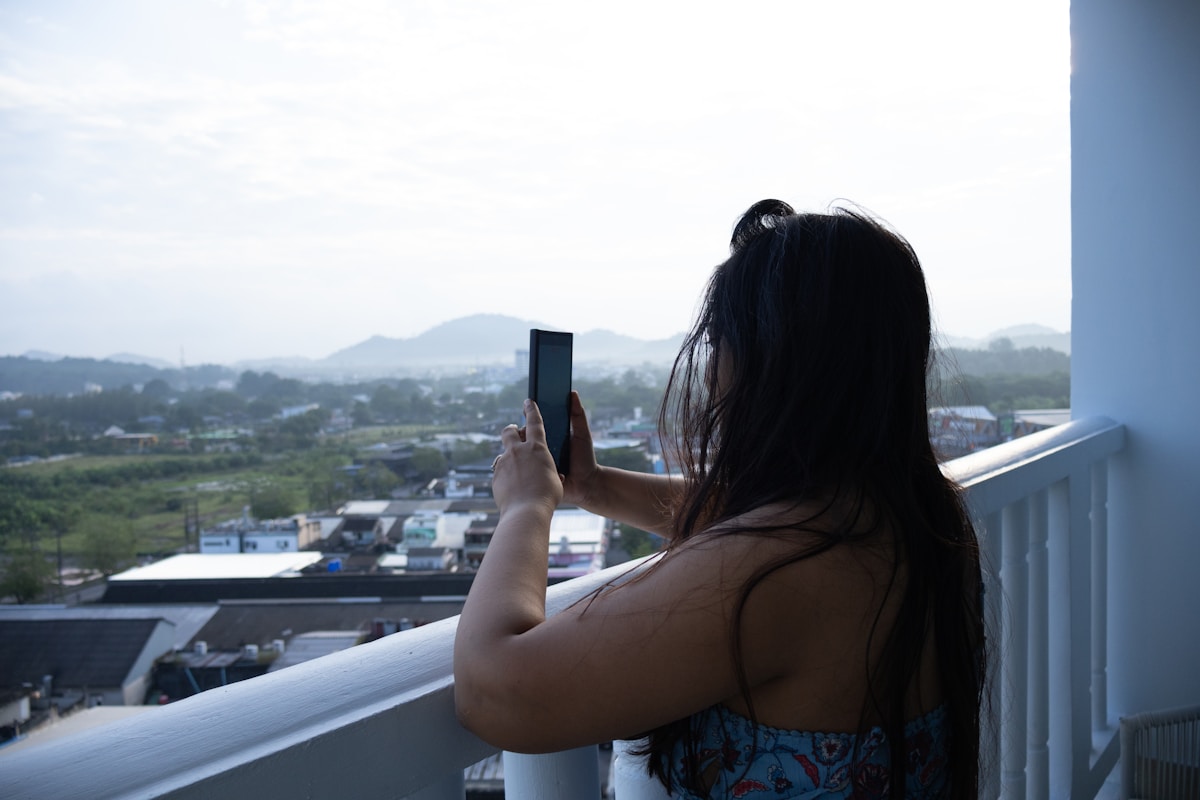 A hotel guest photographing the view from her balcony - the kind of source asset no AI tool can generate